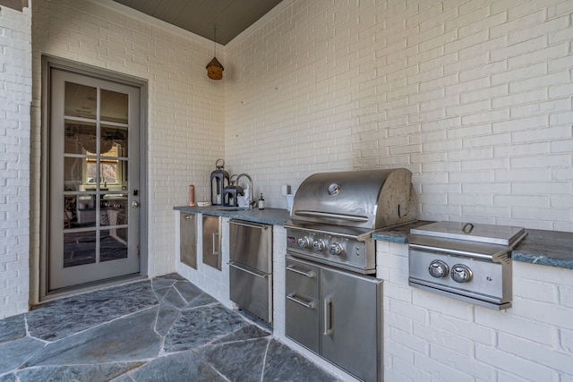 view of patio featuring a sink and a grill