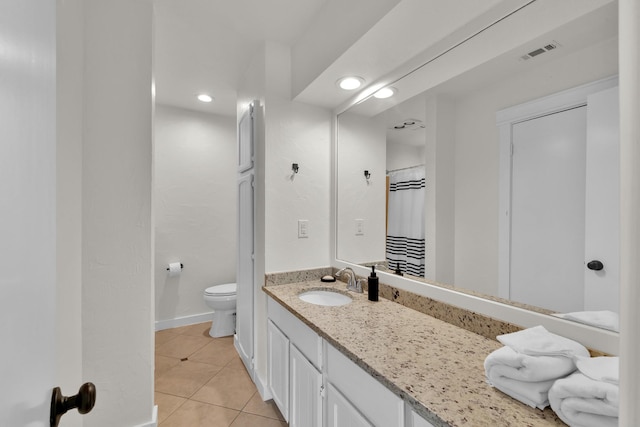 9231 Chimney Corner Ln, Dallas, TX 75243 - bathroom featuring tile patterned flooring, vanity, and recessed lighting