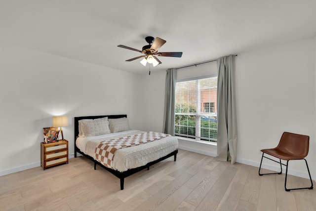 9231 Chimney Corner Ln, Dallas, TX 75243 - bedroom featuring light wood finished floors and ceiling fan
