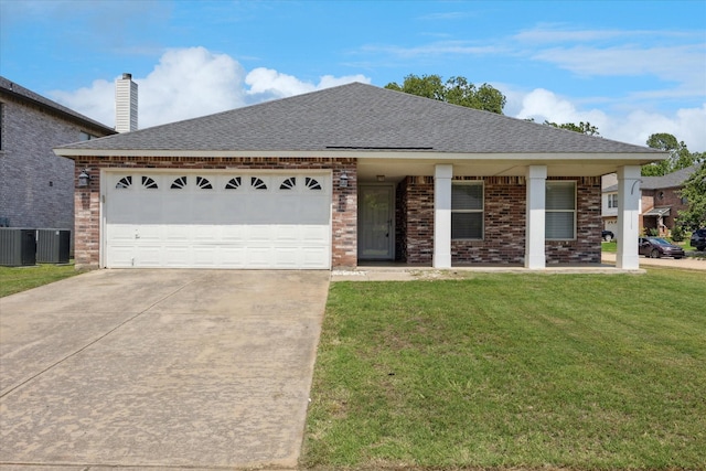 view of front facade with concrete driveway, brick siding, a front yard, a garage, and a shingled roof