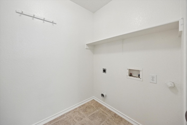 washroom featuring washer hookup, baseboards, and electric dryer hookup