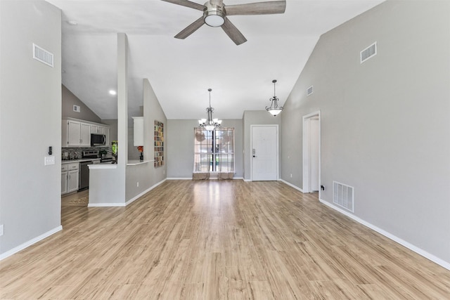 608 Concho Dr, Oak Point, TX 75068 - unfurnished living room featuring high vaulted ceiling, a ceiling fan, light wood-style floors, and a chandelier