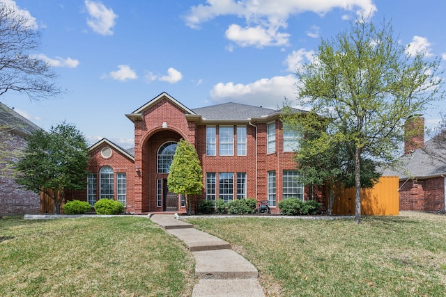 4597 Old Pond Dr, Plano, TX 75024 - view of front facade with a yard, fence, a shingled roof, and brick siding