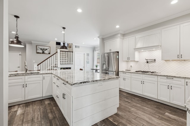 4597 Old Pond Dr, Plano, TX 75024 - kitchen featuring stainless steel appliances, visible vents, crown molding, dark wood-style flooring, and white cabinetry