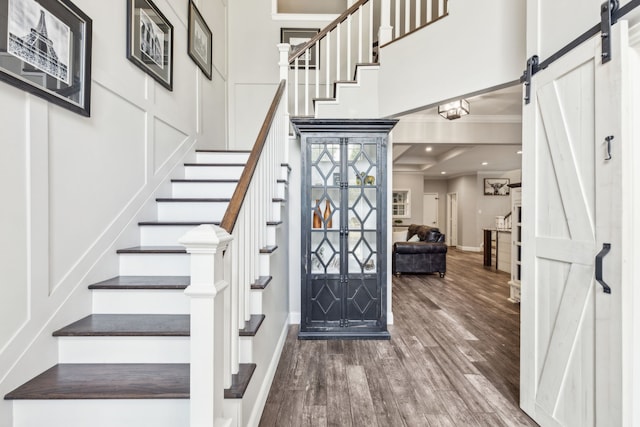 4597 Old Pond Dr, Plano, TX 75024 - dining space featuring dark wood finished floors, a healthy amount of sunlight, ornamental molding, and a notable chandelier