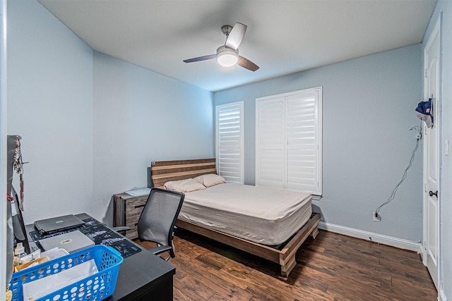 bedroom featuring baseboards, ceiling fan, and wood finished floors