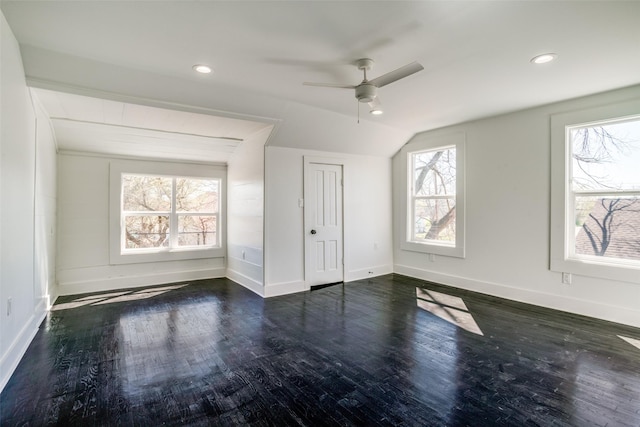 unfurnished bedroom with baseboards, vaulted ceiling, wood finished floors, and recessed lighting