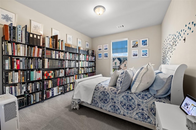 bedroom featuring carpet flooring and visible vents