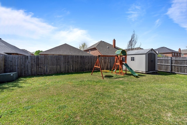 2416 Grand Rapids Dr, Fort Worth, TX 76177 - view of yard with a shed, a playground, and an outbuilding
