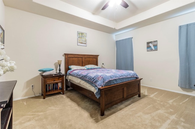 1129 Hidden Lake Dr, Burleson, TX 76028 - bedroom with baseboards, a ceiling fan, a raised ceiling, and light carpet
