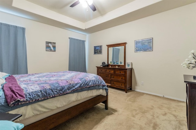 1129 Hidden Lake Dr, Burleson, TX 76028 - bedroom with a tray ceiling, light colored carpet, ceiling fan, and baseboards