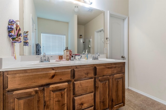 full bath featuring double vanity, a sink, tile patterned flooring, and visible vents