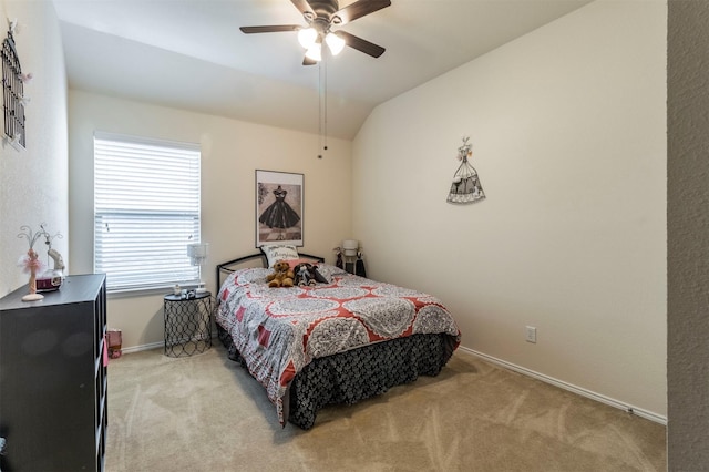 bedroom with light carpet, ceiling fan, baseboards, and lofted ceiling