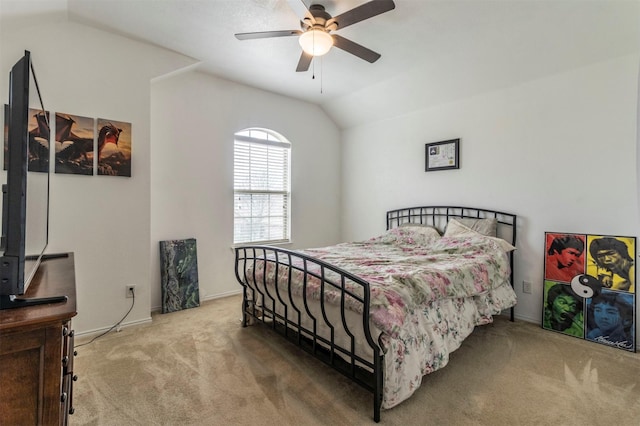 bedroom with carpet, baseboards, vaulted ceiling, and ceiling fan