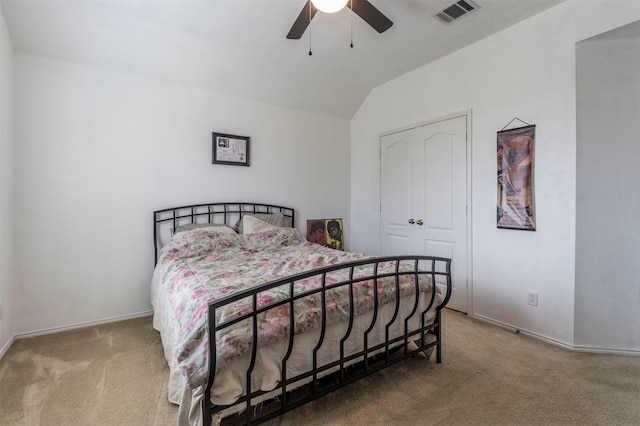 bedroom featuring baseboards, vaulted ceiling, carpet flooring, a ceiling fan, and visible vents