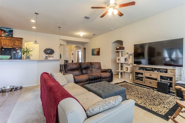 1129 Hidden Lake Dr, Burleson, TX 76028 - living room with visible vents, light tile patterned floors, arched walkways, ceiling fan, and recessed lighting