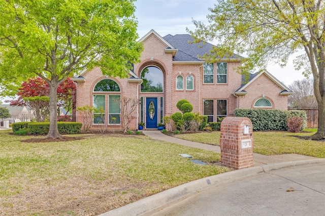 5 Pamela Ct, Mansfield, TX 76063 - view of front of home featuring brick siding, roof with shingles, and a front yard