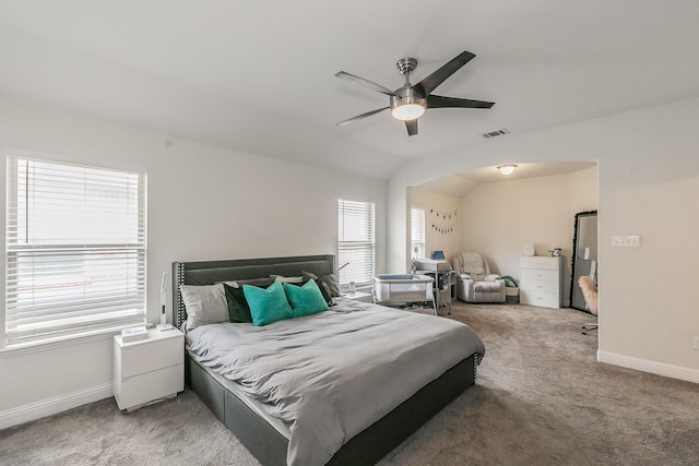 bedroom with vaulted ceiling, baseboards, visible vents, ceiling fan, and carpet floors