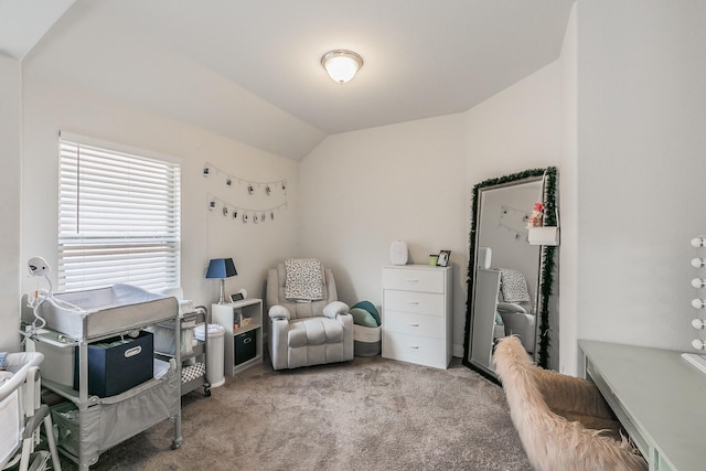 carpeted bedroom with lofted ceiling