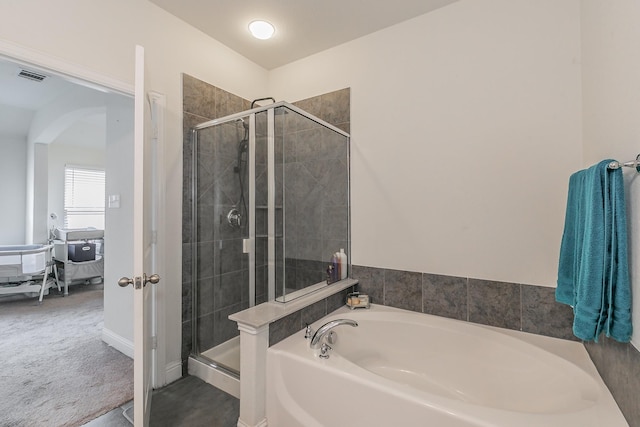 ensuite bathroom featuring a bath, visible vents, a stall shower, and ensuite bathroom