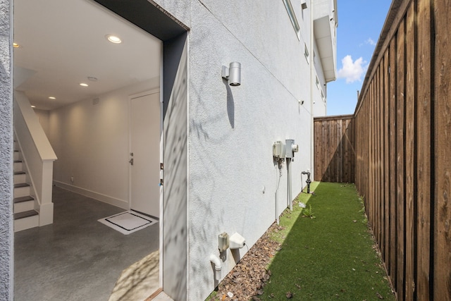 4980 Fuqua St, Dallas, TX 75206 - view of side of property featuring stucco siding and fence