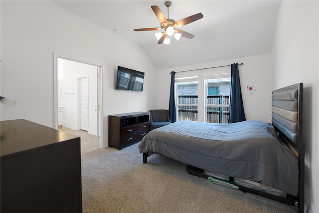 bedroom with light colored carpet, lofted ceiling, and ceiling fan