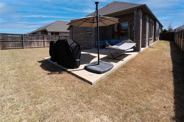view of yard featuring a patio and a fenced backyard