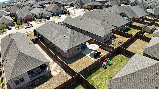 birds eye view of property with a residential view