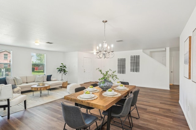 2905 Meadow Bluff Dr, Wylie, TX 75098 - dining room featuring a chandelier, dark wood finished floors, and baseboards