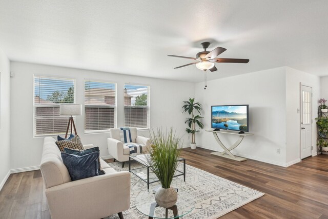 2905 Meadow Bluff Dr, Wylie, TX 75098 - living area featuring wood finished floors, baseboards, and a ceiling fan