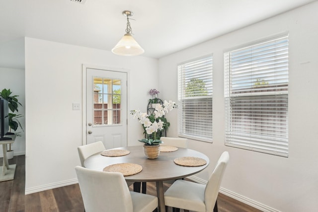 2905 Meadow Bluff Dr, Wylie, TX 75098 - dining area with dark wood-style floors and baseboards