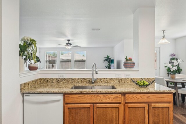 2905 Meadow Bluff Dr, Wylie, TX 75098 - kitchen featuring dishwasher, a sink, a ceiling fan, and light stone counters