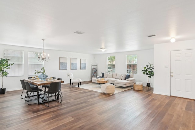 2905 Meadow Bluff Dr, Wylie, TX 75098 - living room featuring wood finished floors, a chandelier, and baseboards