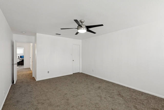 2905 Meadow Bluff Dr, Wylie, TX 75098 - unfurnished bedroom featuring dark colored carpet, ceiling fan, and baseboards