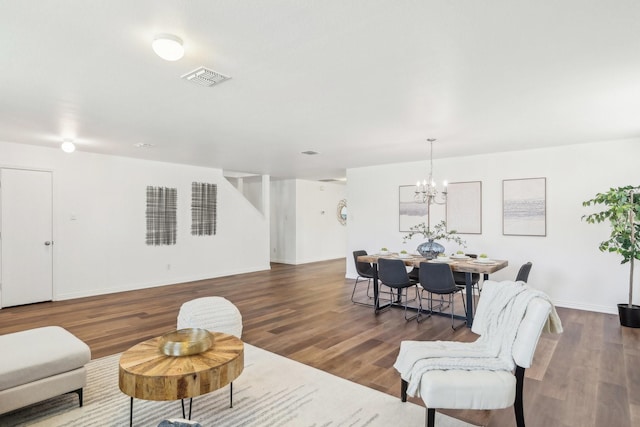 2905 Meadow Bluff Dr, Wylie, TX 75098 - living area with a chandelier, wood finished floors, and baseboards