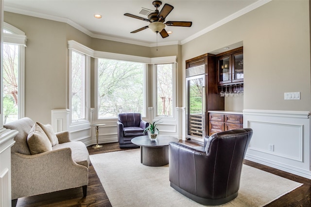 5816 Forest Highlands Dr, Fort Worth, TX 76132 - living room with a bar, a ceiling fan, ornamental molding, and dark wood-style floors