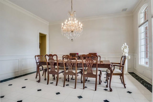 5816 Forest Highlands Dr, Fort Worth, TX 76132 - dining room with crown molding, light tile patterned floors, a chandelier, visible vents, and wainscoting