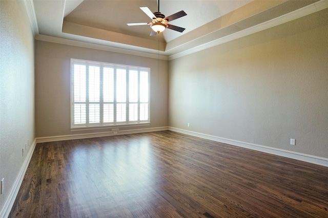 1304 Rollie Michael Ln, Fort Worth, TX 76179 - unfurnished room featuring ornamental molding, a ceiling fan, a tray ceiling, and dark wood-style flooring
