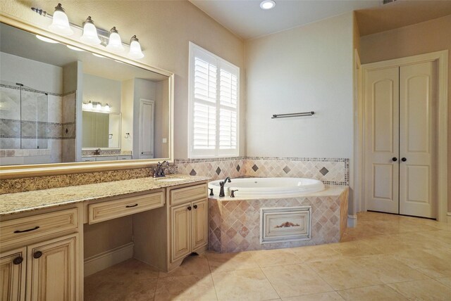 1304 Rollie Michael Ln, Fort Worth, TX 76179 - bathroom featuring vanity, tile patterned flooring, a garden tub, and recessed lighting