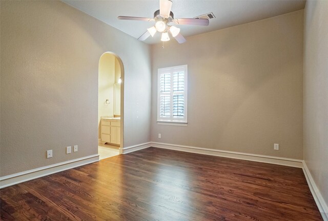 1304 Rollie Michael Ln, Fort Worth, TX 76179 - empty room with visible vents, wood finished floors, baseboards, ceiling fan, and arched walkways