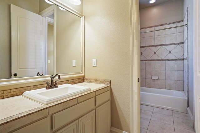 1304 Rollie Michael Ln, Fort Worth, TX 76179 - bathroom with vanity, tile patterned flooring, a textured wall, and  shower combination