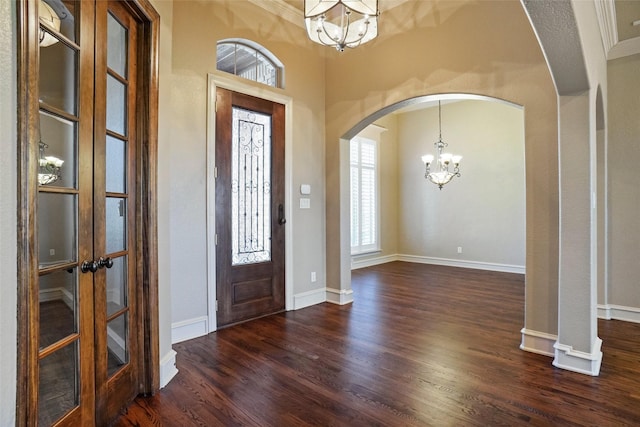 1304 Rollie Michael Ln, Fort Worth, TX 76179 - entryway featuring arched walkways, a chandelier, french doors, baseboards, and dark wood-type flooring