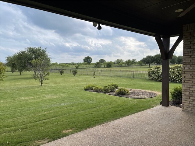 1304 Rollie Michael Ln, Fort Worth, TX 76179 - view of yard featuring a patio, fence, and a rural view