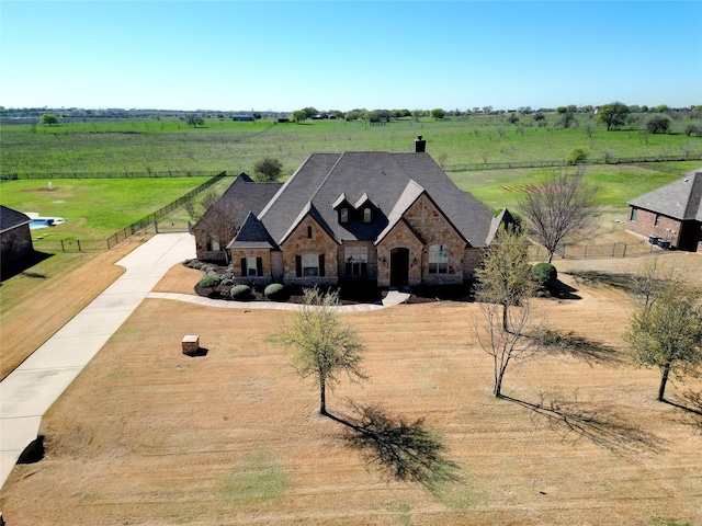 1304 Rollie Michael Ln, Fort Worth, TX 76179 - view of front of property with a rural view, driveway, a chimney, and stone siding