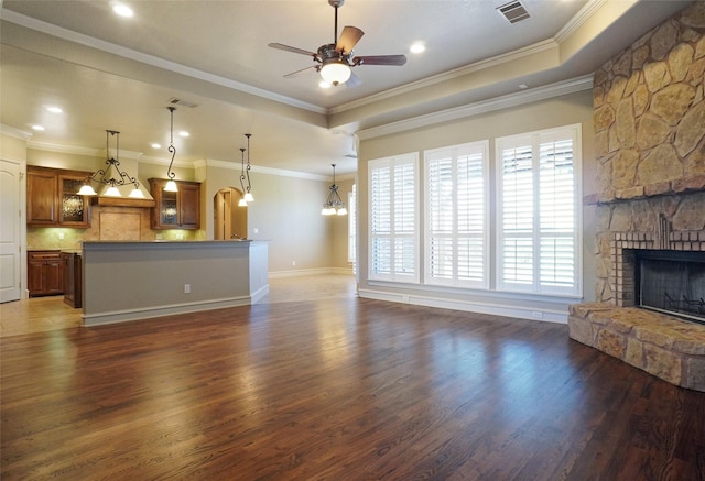 1304 Rollie Michael Ln, Fort Worth, TX 76179 - unfurnished living room with visible vents, ceiling fan, wood finished floors, and a stone fireplace
