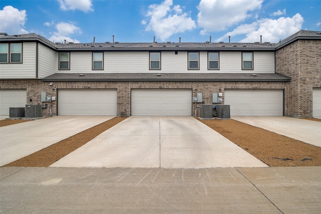 6510 Baritone Ct, Sachse, TX 75048 - view of property featuring an attached garage, cooling unit, brick siding, and concrete driveway