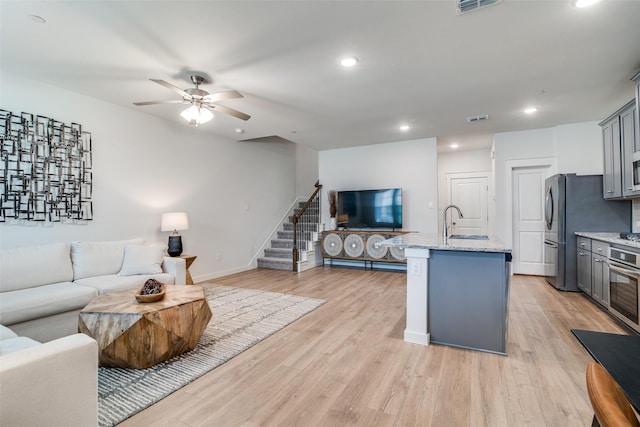 6510 Baritone Ct, Sachse, TX 75048 - living area with a ceiling fan, stairway, light wood-style flooring, recessed lighting, and baseboards
