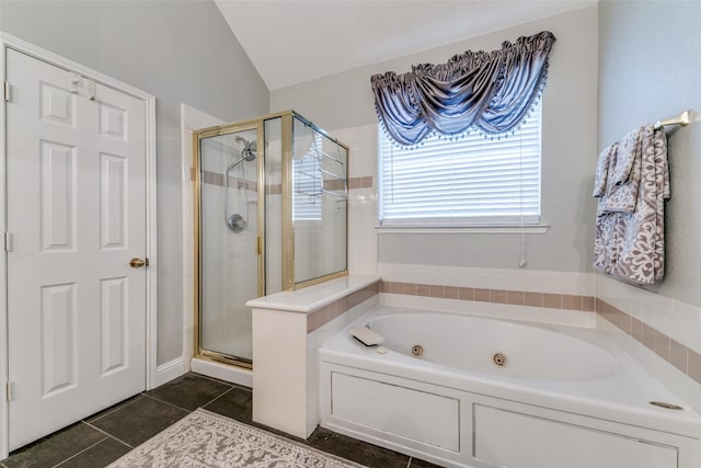 209 Timberbluff Ln, Murphy, TX 75094 - bathroom featuring tile patterned floors, vaulted ceiling, a shower stall, and a jetted tub