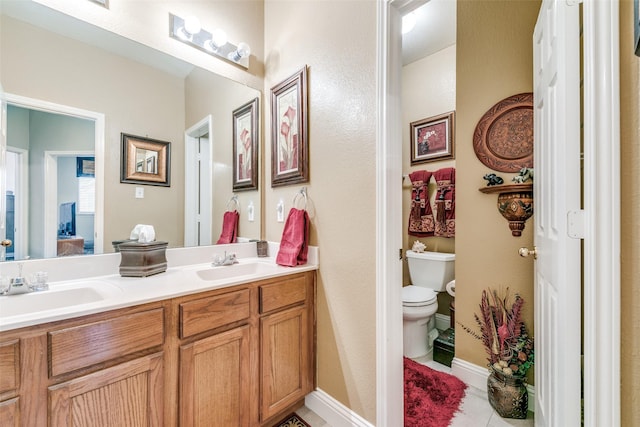 209 Timberbluff Ln, Murphy, TX 75094 - full bath featuring double vanity, toilet, tile patterned floors, and a sink