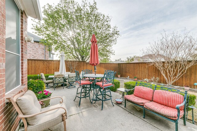 209 Timberbluff Ln, Murphy, TX 75094 - view of patio / terrace with outdoor dining area, a fenced backyard, and outdoor lounge area